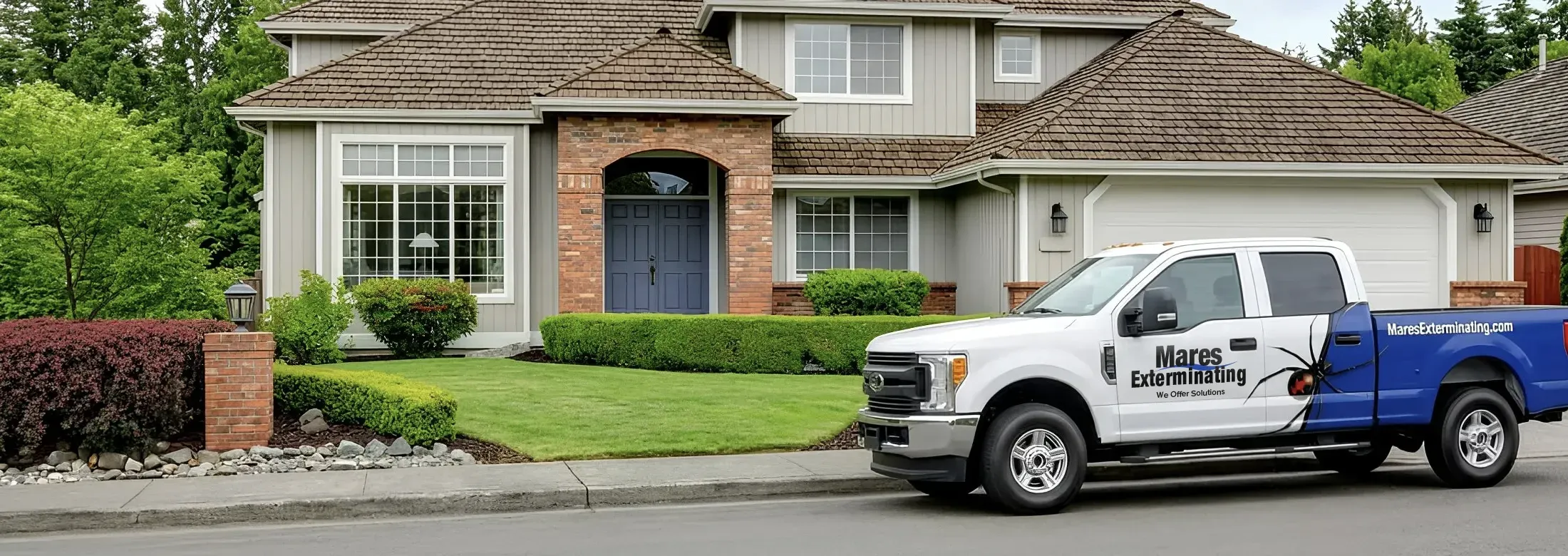 Mares Exterminating Truck parked in front of a house
